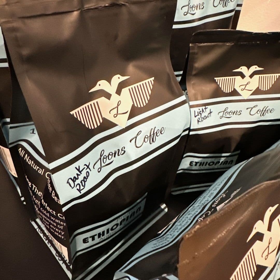 Bags of Loons Coffee single-origin beans, dark and light roast